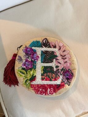 Anthropologie Cream Bag with Pink Tassel